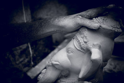 Close-up of woman hand statue