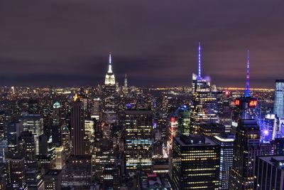 Illuminated buildings in city at night