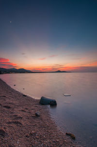 Scenic view of sea at sunset