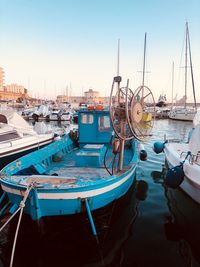 Boats moored at harbor