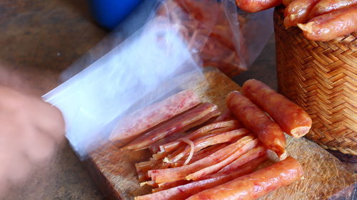 Close-up of person preparing food for sale at market