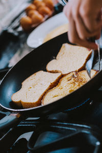 Close-up of man preparing toasts 