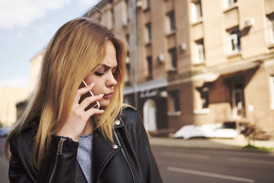 Young woman talking on phone