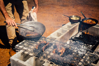 High angle view of meat on barbecue grill