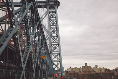 Low angle view of williamsburg bridge against sky