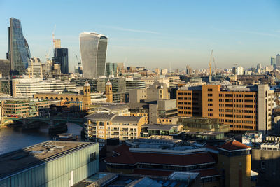 Modern buildings in city against sky