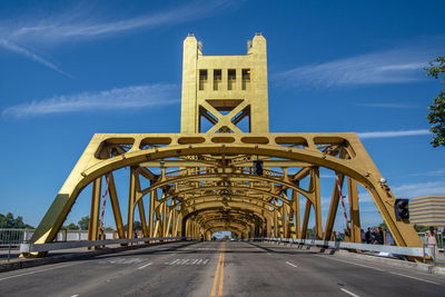 View of bridge against cloudy sky