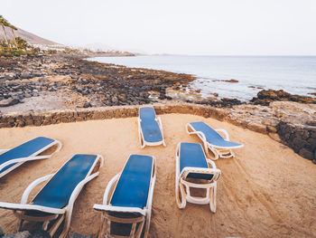 Deck chairs on beach