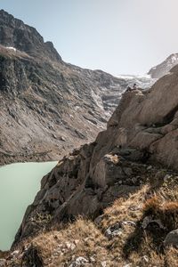 Scenic view of lake and mountains against clear sky