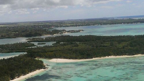 Scenic view of sea against cloudy sky