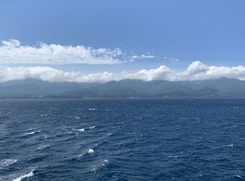 Scenic view of sea against blue sky