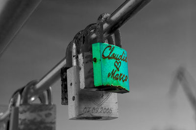 Close-up of padlocks hanging on metal