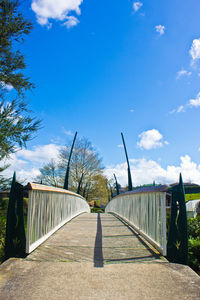 Walkway leading to bridge over river