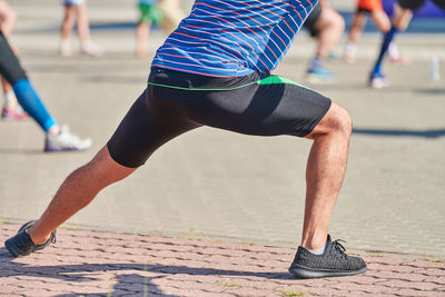 Low section of man exercising outdoors