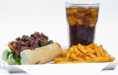 Close-up of food on table against white background