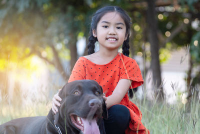 Portrait of girl with dog