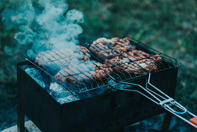 High angle view of meat on barbecue grill