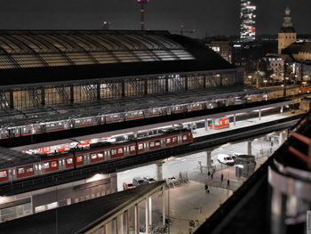 Illuminated city against sky at night
