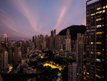 Panoramic view of illuminated buildings against sky at night