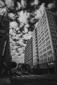 City street and buildings against sky