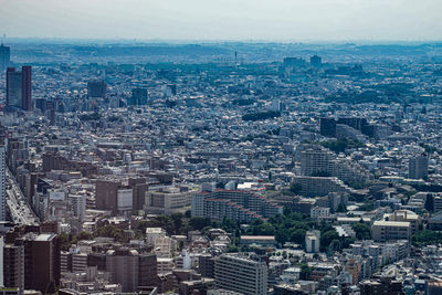 High angle view of modern buildings in city against sky