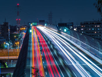 High angle view of light trails on road at night