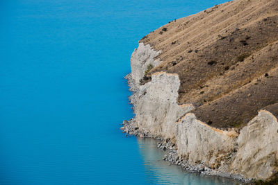 High angle view of cliff in lake pukaki