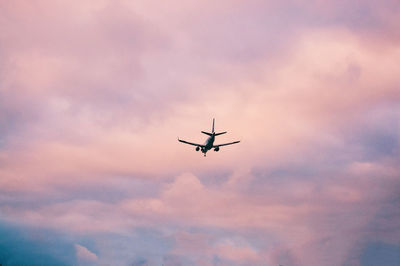 Airplane flying against sky 