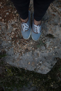 Low section of woman standing on tiled floor