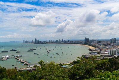 High angle view of bay and buildings against sky