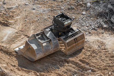 High angle view of abandoned car on field