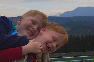 Happy boys posing outdoors