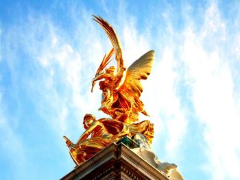 Low angle view of statue against sky