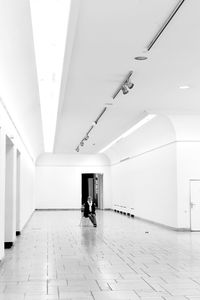 Woman sitting on chair at building