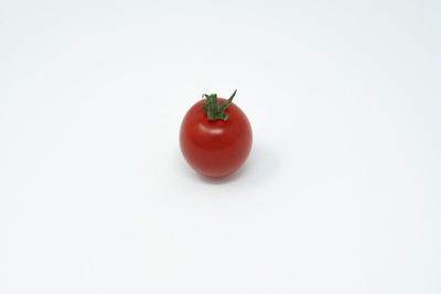 Close-up of cherry tomatoes against white background
