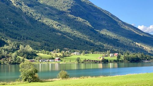 Scenic view of lake and mountains against sky