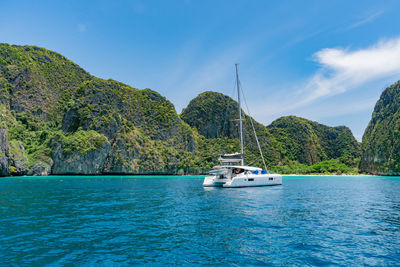 Luxury white yacht in andaman ocean, maya bay  on phi phi leh island, thailand