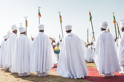 Panoramic view of people against sky