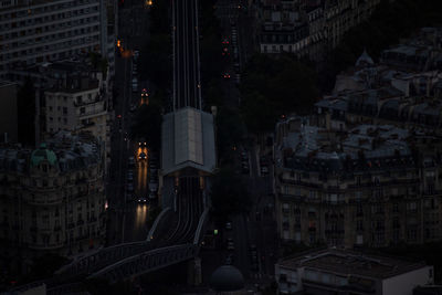 High angle view of illuminated buildings in city at night