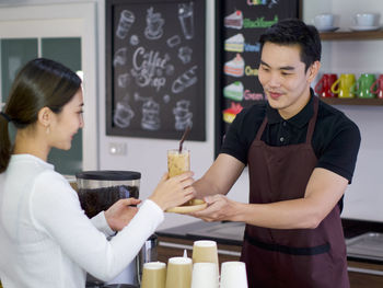 Woman standing at restaurant