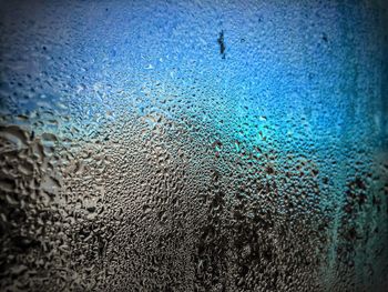 Full frame shot of water drops on window