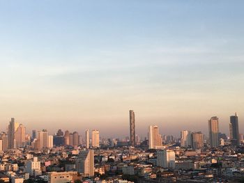 Aerial view of modern buildings in city against sky