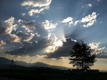 Scenic view of landscape against cloudy sky