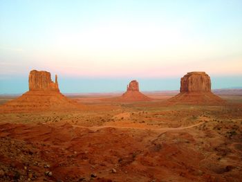 Rock formations in desert against sky