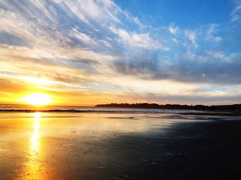 Scenic view of sea against sky at sunset