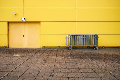 Empty chairs against wall