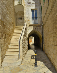 Empty alley amidst buildings