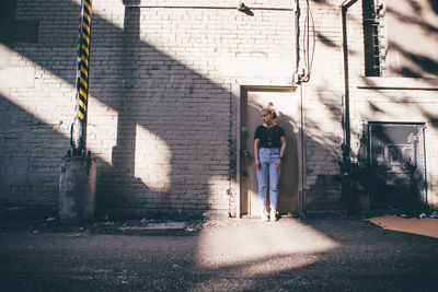 Portrait of man standing on cobblestone street