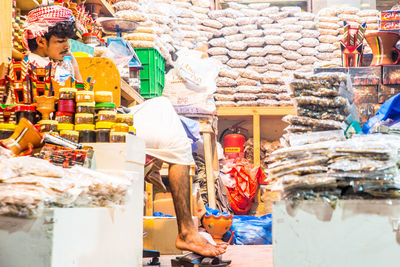 People working at market stall