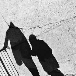 High angle view of shadow of man